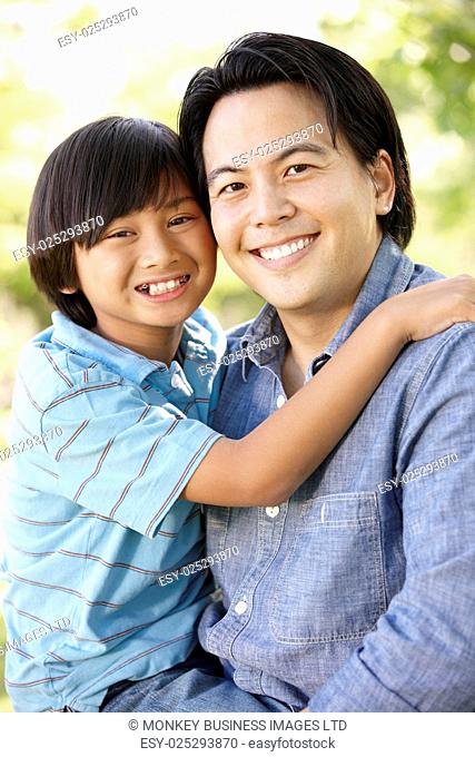 Portrait Asian father and son outdoors