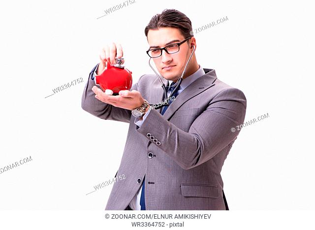 Businessman with stethoscope and piggybank isolated withe background