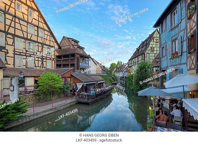 Restaurant and half timbered houses at the Lauch river, Little Venice, Colmar, Alsace, France, Europe