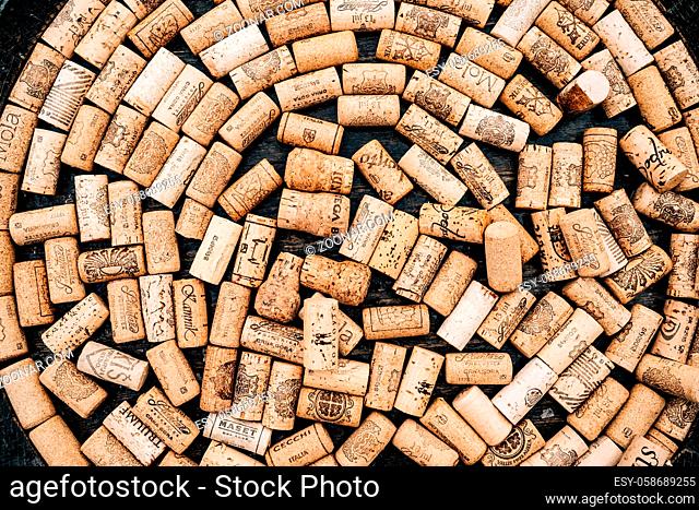 Circle made of wine corks from wine bottles on wooden texture. High quality photo