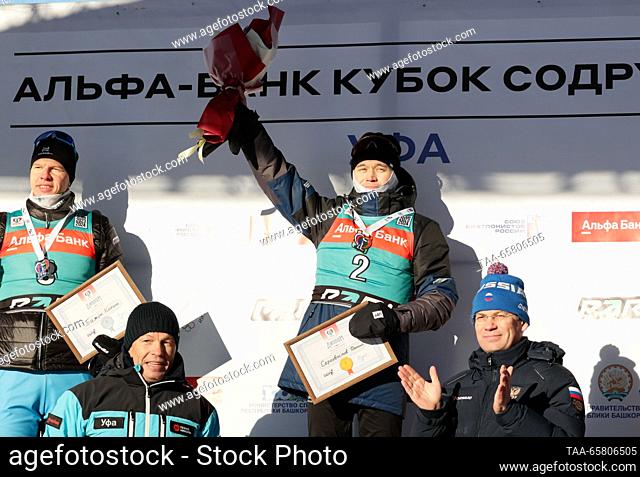 RUSSIA, UFA - DECEMBER 16, 2023: Silver medallist Kirill Bazhin of Russia and gold medal winner Daniil Serokhvostov of Russia (top L-R) celebrate during the...
