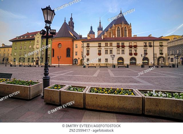 Krakow, Poland. The small market square near Mariacki church, perspective view of building's walls. Image is taken in sunrise time