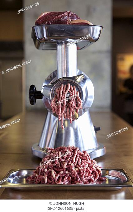 Minced meat in mincer