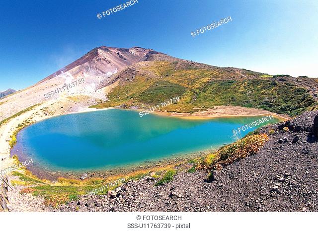 a Little Pond In Front of the Mt. Asahidake Under a Blue Sky, Front View, Hokkaido Prefecture, Japan