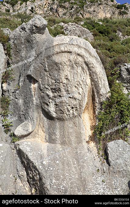 The Charonion of Hell (Water Sprite of Hell) is located north of the cave church of St. Pierre (about 200 m) and is an ancient carved stone bust in the hillside...