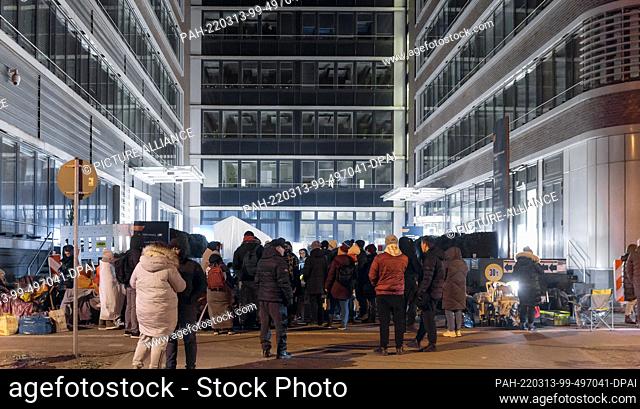 12 March 2022, Hamburg: Refugees from Ukraine wait in front of the Hammer Straße registration office. They hold out overnight on site in order not to lose their...