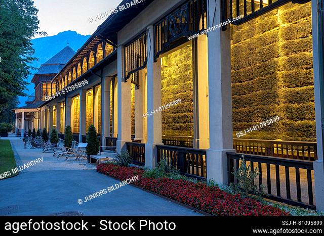 The illuminated graduation house in the spa garden of Bad Reichenhall in the blue hour. District of Berchtesgadener Land, Upper Bavaria, Germany