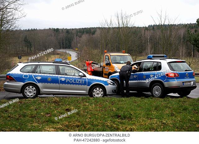 Police officers close Federal Highway 170 for the detonation of a WWII aerial bomb between Karsdorf and Oberhaeslich, Germany, 19 March 2014