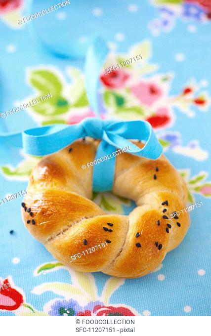 Poppy seeds bagel with tie with ribbon