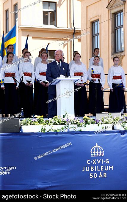 King Carl Gustaf holds his speech at the castle slope by the Royal Palace in Stockholm, Sweden, on June 22, 2023, during the royal visit to Stockholm County to...