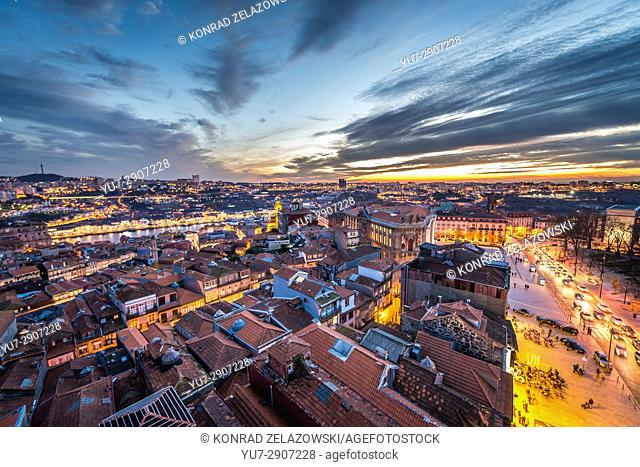 Evening in Porto, second largest city in Portugal. Aerial view from bell tower of Clerigos Church with Douro River