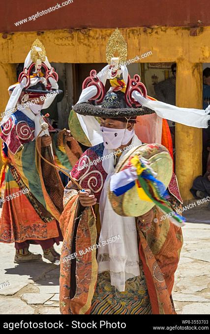 Cham dancers performing the Black Hat Dance (shana), circling the flagpole in the courtyard of Korzok Gompa during the Korzok Gustor, Lake Tsomoriri