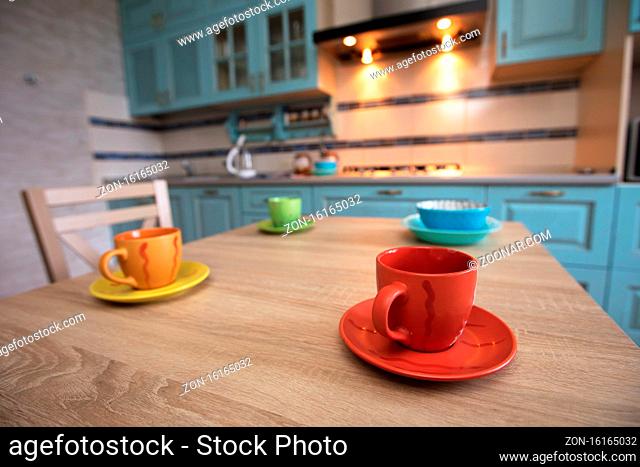 Tea cups on the table against the background of the kitchen