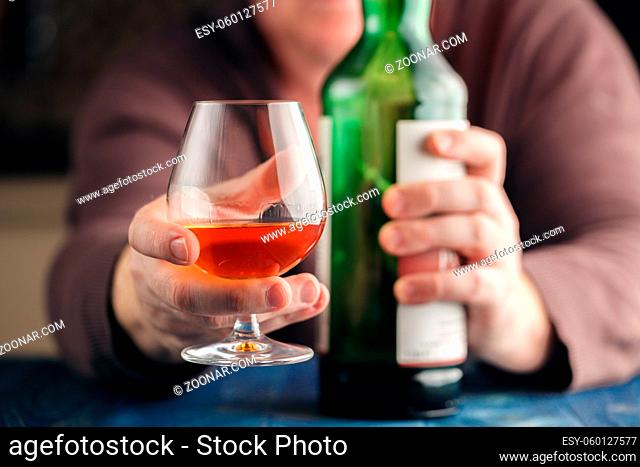 Man alone relax with alcohol after hard work