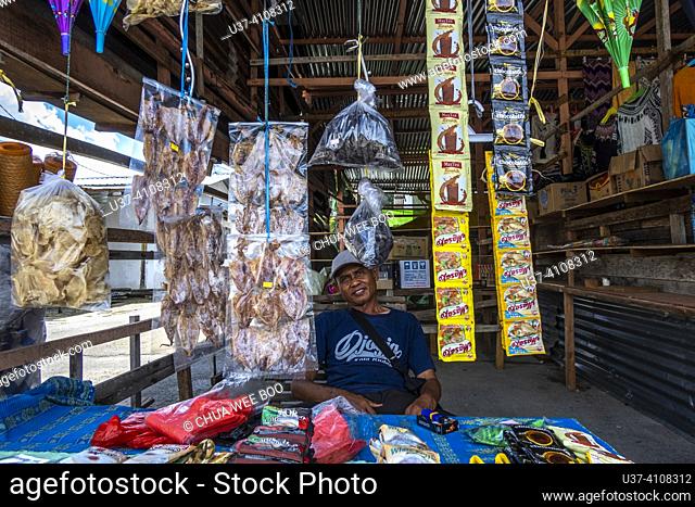 Hawker stalls at Serikin. Malaysia-Indonesia Border, Sarawak, Malaysia. Hawker stalls at Serikin offer a variety of local dresses an textile