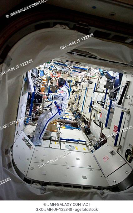Attired in his Russian Sokol launch and entry suit, NASA astronaut T.J. Creamer, Expedition 23 flight engineer, works in the Destiny laboratory of the...