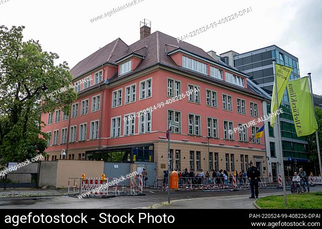 24 May 2022, Berlin: People stand in front of the Embassy of Ukraine. Three months ago, on February 24, Russia had launched a war of aggression against Ukraine
