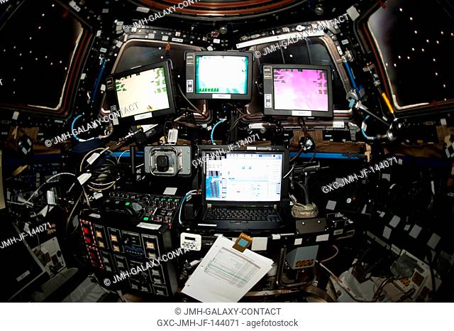 The robotics workstation inside the station's Cupola module is seen prior to the robotic capture of SpaceX's Dragon cargo craft