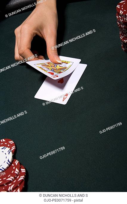Woman playing blackjack in casino