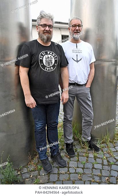 The authors Arnd Rueskamp (r) and Hendrik Neubauer (l) posing before a reading from their book 'Strand ohne Wiederkehr' (lit