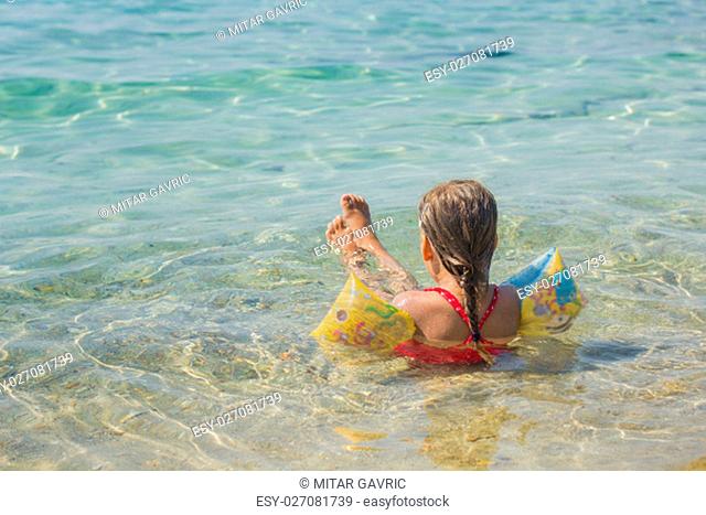 Little girl relaxing in the sea. Summer Vacation