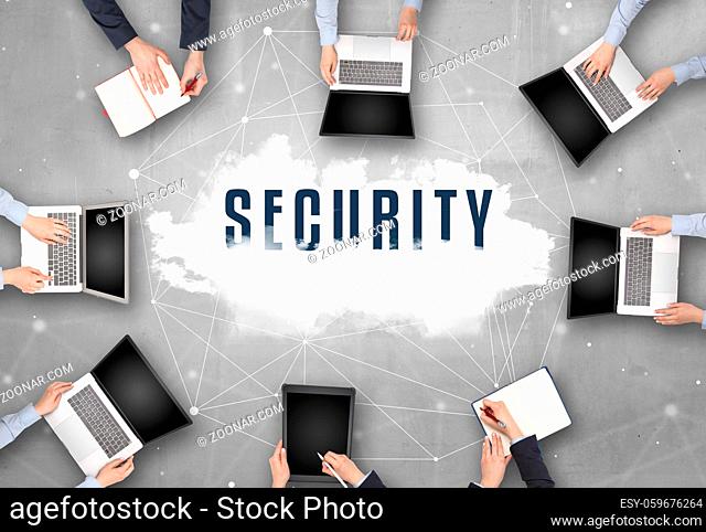 Group of people having a meeting with SECURITY insciption, web security concept