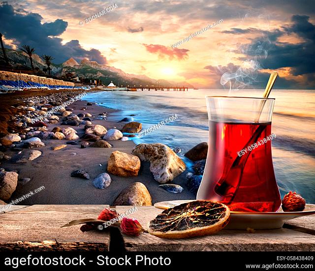 Traditional turkish tea on coastline of mediterranean sea