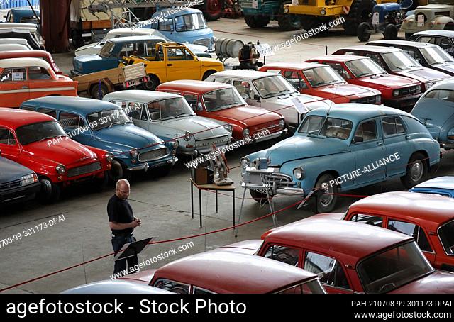 06 July 2021, Mecklenburg-Western Pomerania, Ribnitz-Damgarten: Passenger cars from the East are on display in an exhibition hall at the Pütnitz Museum of...