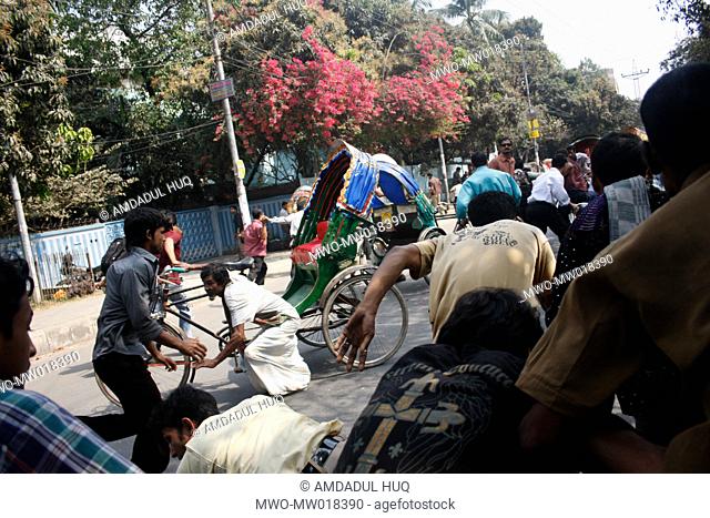 Panic stricken people run for safety amidst heavy gun fire from BDR Headquarters, in Pilkhana A mutiny by Bangladesh Rifles, BDR