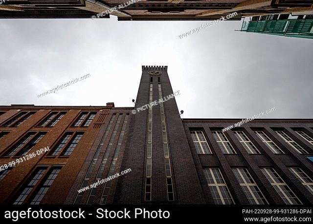 28 September 2022, Saxony, Chemnitz: The industrial architecture of the former knitting machine factory in Chemnitz, with its striking Art Deco clock tower