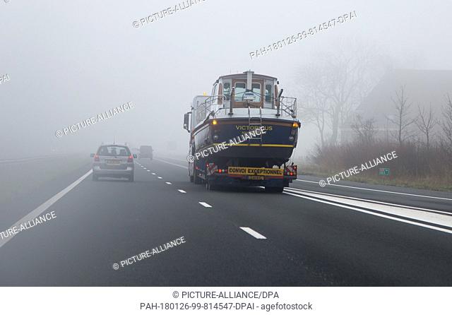 A boat is transported with a trailer on a road near the Dutch town Leeuwarden in the Netherlands, 26 January 2018. Leeuwarden in the Frisian province is the...