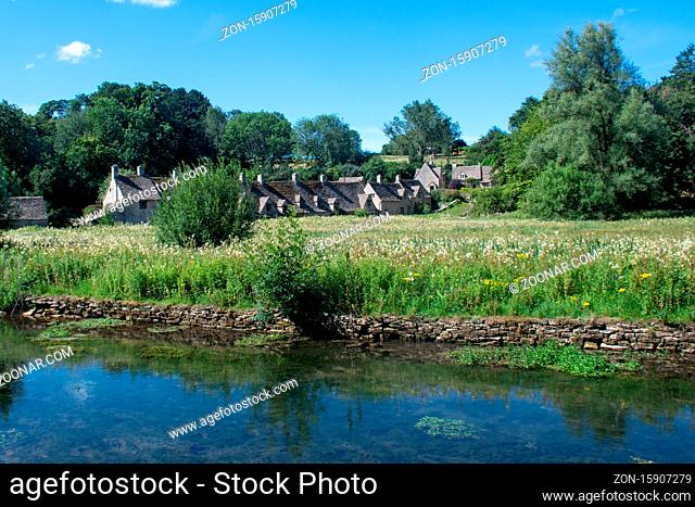 Arlington Row Cottages in Bibury the Cotswolds with stream in the foreground