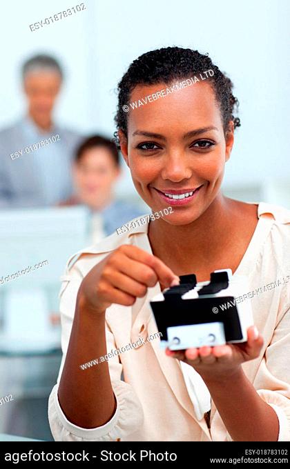 Cheerful businesswoman searching for the index