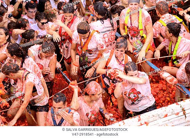 Young people enjoying the Tomatina, the world's largest tomato fight, Tomatina, Buñol, Valencia, Spain