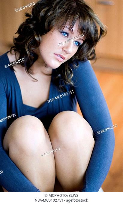 portrait of a cute dark-haired women with blue eyes