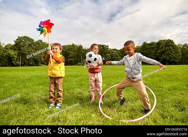 happy children with toys playing at park