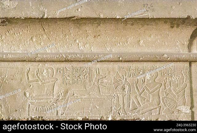 Cairo, Egyptian Museum, from Guiza, tomb of Khaemouaset. Lintel with cornice, deceased and his son Ptahnufer kneeling before Isis and Anubis