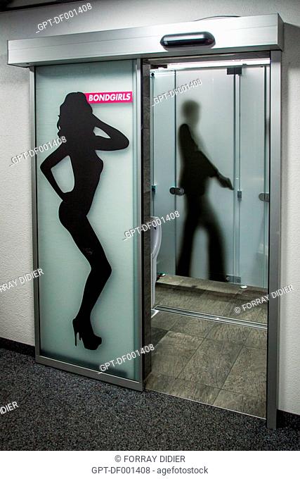 IMAGES OF A WOMAN AND A SECRET AGENT ON THE DOORS TO THE RESTROOMS IN THE RESTAURANT AT THE SUMMIT OF THE SCHILTORN, THE PLACE WHERE THE FILM ON HER MAJESTY'S...