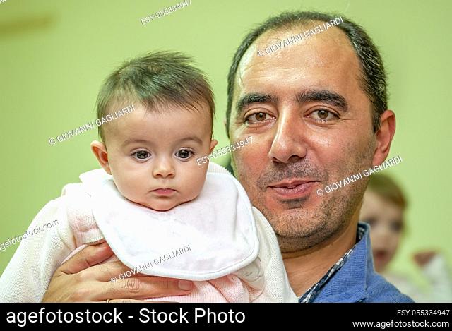 Man holding his young daughter