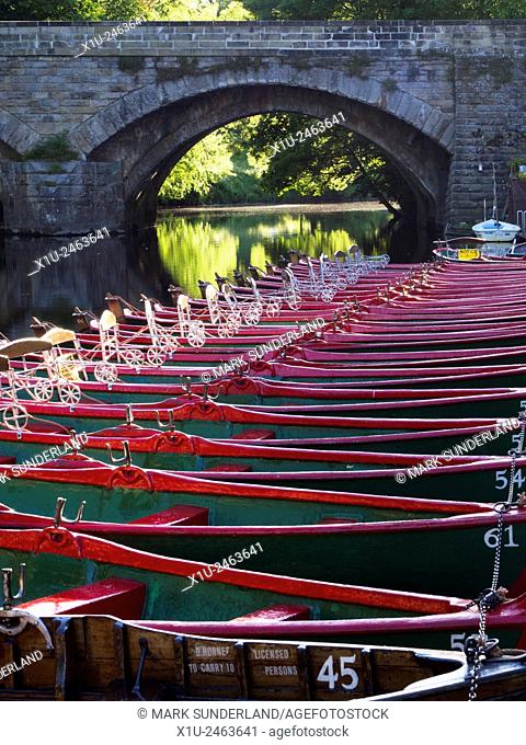 Rowing Boats Moored by High Bridge on the River Nidd at Knaresborough North Yorkshire England