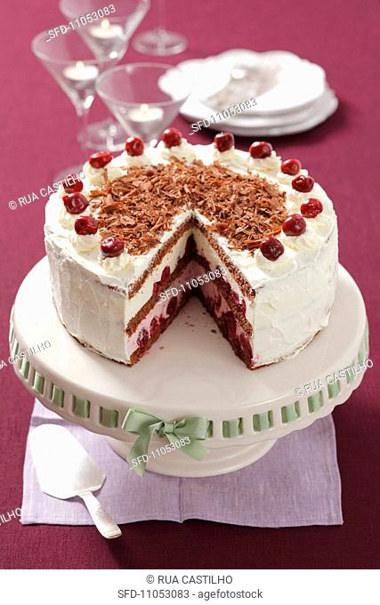 Black Forest Gateaux, sliced, on a cake stand