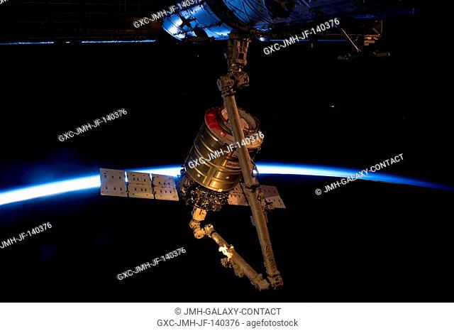 Intersecting the thin line of Earth's atmosphere, the Orbital Sciences' Cygnus cargo craft attached to the end of the Canadarm2 robotic arm of the International...