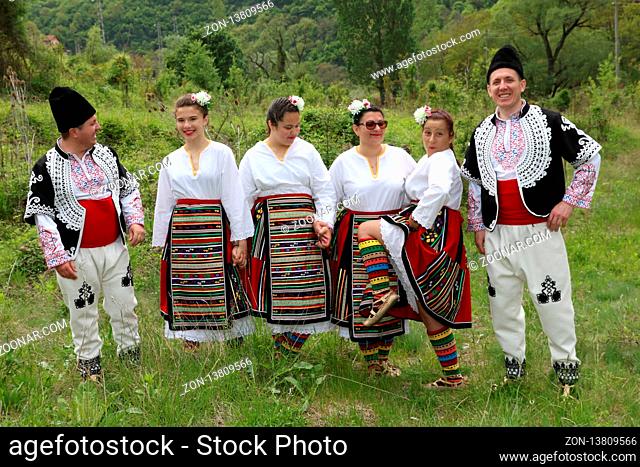 Gara Bov, Bulgaria - May 4, 2019: People dressed with traditional Bulgarian authentic folklore clothes dance Bulgarian horo in Gara Bov, Bulgaria