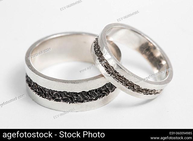 Two wedding rings on a white background. Mr. and Mrs