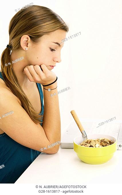 Teenage girl refusing to eat her cereals suffering from anorexia