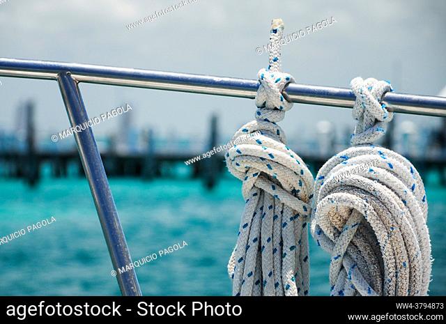 Tied ropes on a sailboat going from Isla Mujeres towards Cancun, Quintana Roo, Mexico