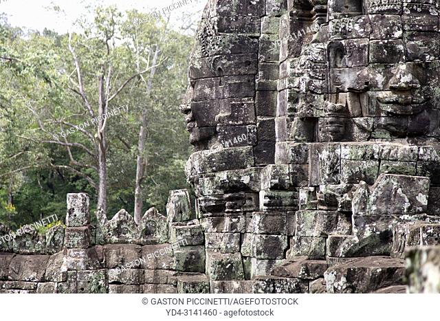 Stone sculptures, faces on the Bayon Temple in Angkor Thom, Angkor Temple Complex, Siem Reap, Cambodia, Southeast Asia. Bayon is a well-known and richly...
