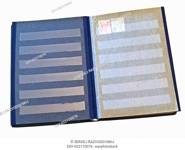 Isolated stamp album with some stamps against the white background
