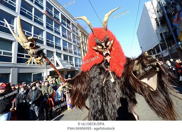 People in costume attend the carnival parade in Mannheim, Germany, 10 February 2013. A day ahead of the traditional main 'Rose Monday' carnival parade in the...