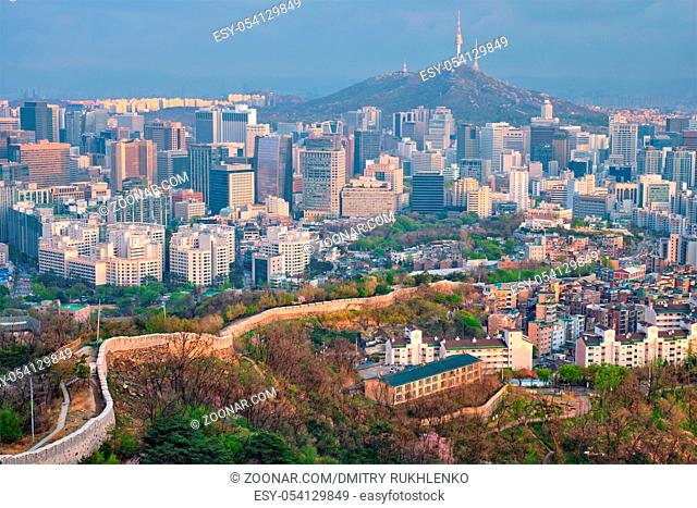 Aerial view of Seoul downtown cityscape and Namsan Seoul Tower on sunset from Inwang mountain. Seoul, South Korea